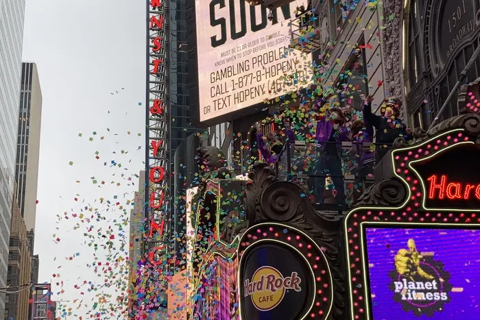 Photograph of confetti being tested - as in, thrown up in the air from the Hard Rock Cafe's marquee - in Times Square